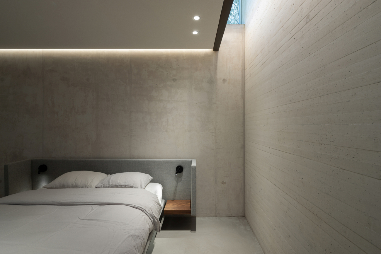 Modern underground house in Netherlands concrete bedroom